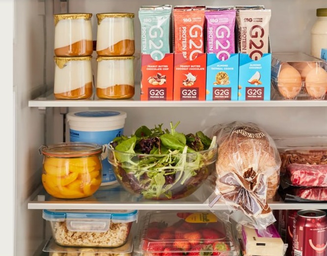 G2G protein bars in a refrigerator alongside fresh food